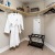 Walk in closet at our active adult apartments in Palm Desert, CA, featuring clothes racks and shelves for storage.